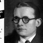 Portret mężczyzny w okularach i garniturze, zdjęcie prasowe z 1935 roku.